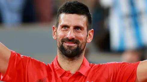 Novak Djokovic of Serbia celebrates winning match point against Mackenzie McDonald of United States during Roland Garros.