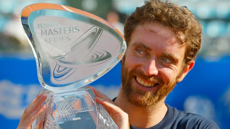 Felix Mantilla of Spain holds aloft the Rome Tennis Masters Series Trophy after defeating Roger Federer of Switzerland in the final.