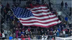 Fans of the United States hold the flag