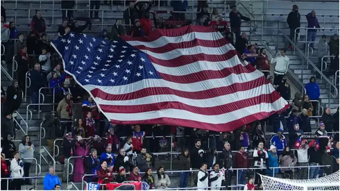 Fans of the United States hold the flag