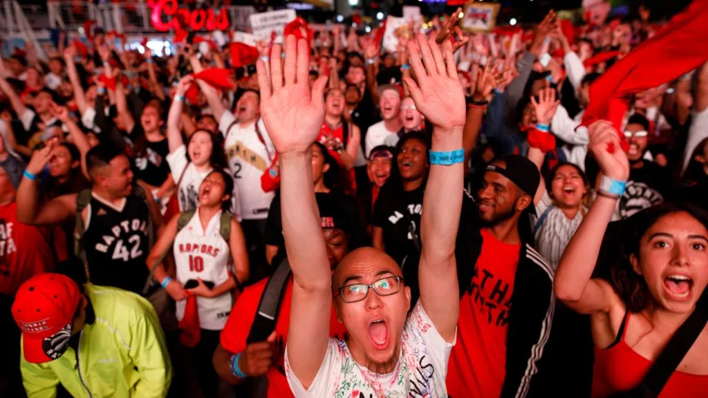 Fans react as Toronto Raptors fans gather to watch Game 4 of the NBA Finals series outside Scotiabank Arena at ‘Jurassic Park’, on June 7, 2019. (Source: Cole Burston/Getty Images)