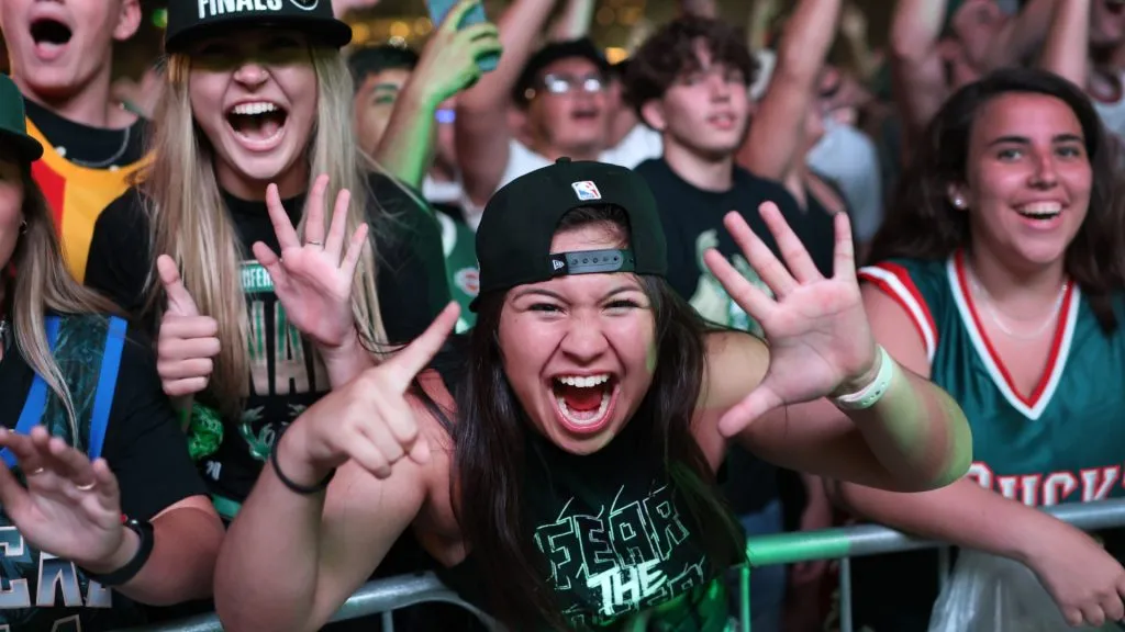 Fans celebrate outside Fiserv Forum as the Milwaukee Bucks defeat the Phoenix Suns in Game Six of the NBA Finals to win the championship on July 20, 2021. (Source: Scott Olson/Getty Images)