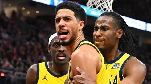 Tyrese Haliburton #0 of the Indiana Pacers celebrates with Pascal Siakam #43 and Aaron Nesmith #23 after making a basket against the Cleveland Cavaliers