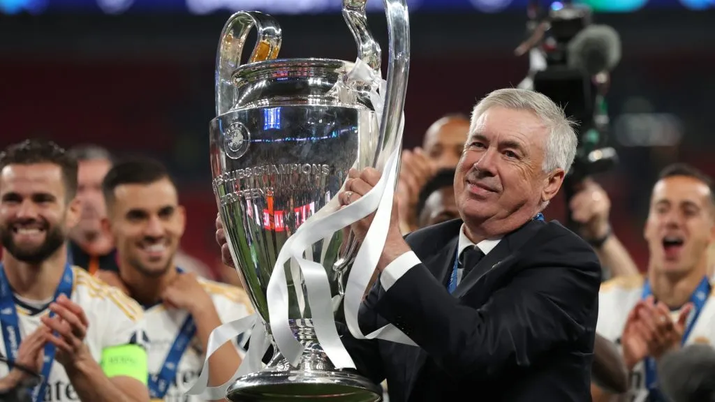 Carlo Ancelotti, Head Coach of Real Madrid, lifts the UEFA Champions League Trophy after his team’s victory during the UEFA Champions League 2023/24 Final match. (Source: Alex Pantling/Getty Images)
