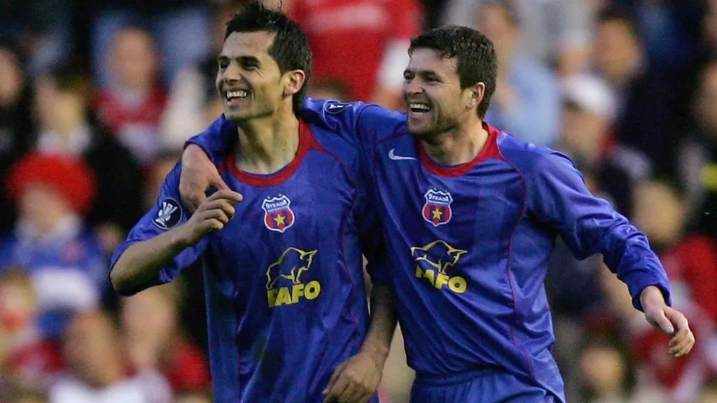 Nicolae Dica of Steaua Bucharest celebrates scoring the opening goal with team mate Daniel Oprita during the UEFA Cup Semi Final in 2006. (Source: Alex Livesey/Getty Images)