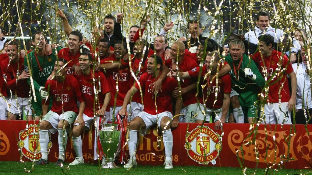 Manchester United players celebrate with the trophy following their team’s victory during the UEFA Champions League Final in 2008. (Source: Alex Livesey/Getty Images)