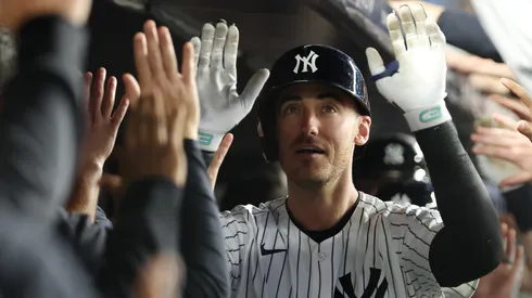 Cody Bellinger #35 of the New York Yankees celebrates after hitting hits a grand slam home run.