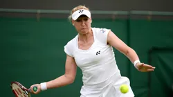 Elena Baltacha of Great Britain plays a forehand during the Ladies' Singles first round match against Flavia Pennetta of Italy on day one of the Wimbledon Lawn Tennis Championships at the All England Lawn Tennis and Croquet Club on June 24, 2013 in London, England.