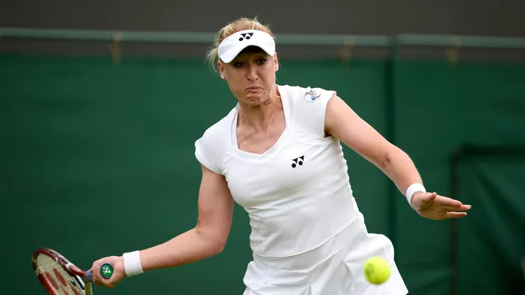 Elena Baltacha of Great Britain plays a forehand during the Ladies' Singles first round match against Flavia Pennetta of Italy on day one of the Wimbledon Lawn Tennis Championships at the All England Lawn Tennis and Croquet Club on June 24, 2013 in London, England.
