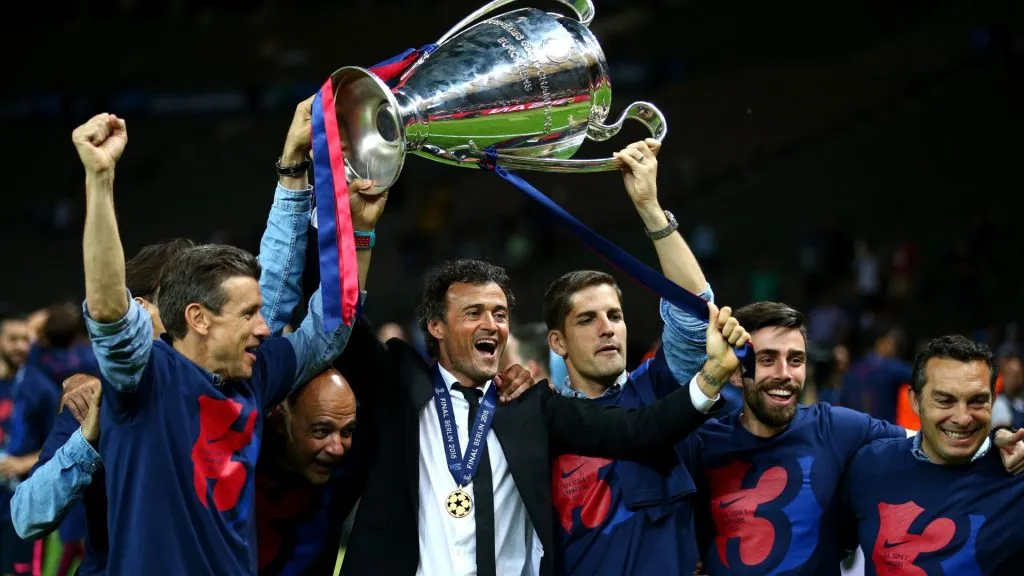 Luis Enrique manager of Barcelona celebrates victory with the trophy after the UEFA Champions League Final between Juventus and FC Barcelona at Olympiastadion on June 6, 2015. (Source: Paul Gilham/Getty Images)