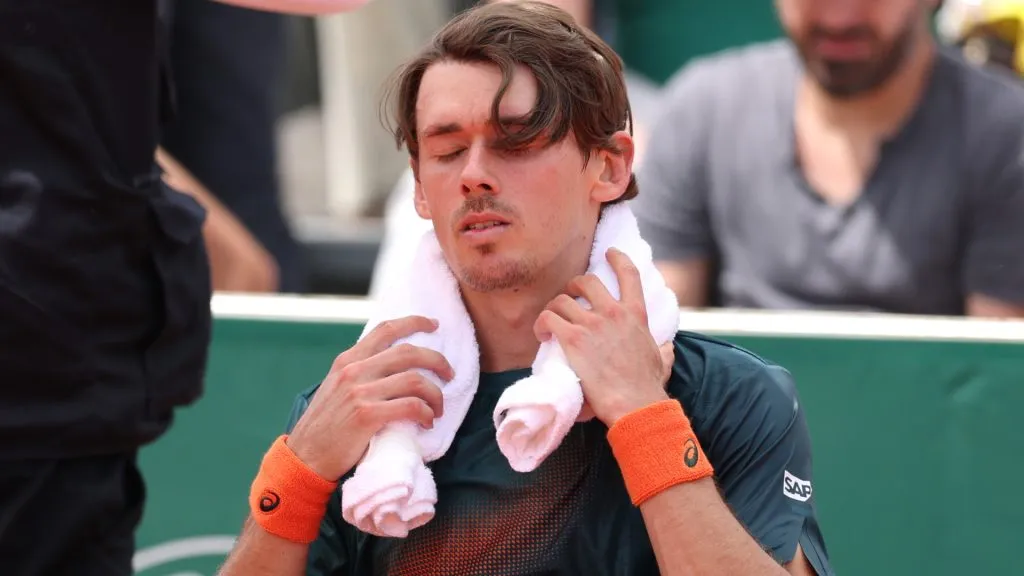 Alex de Minaur of Australia sits on his bench at the change of ends during his Roland Garros match against Alexander Bublik. (Clive Brunskill/Getty Images)