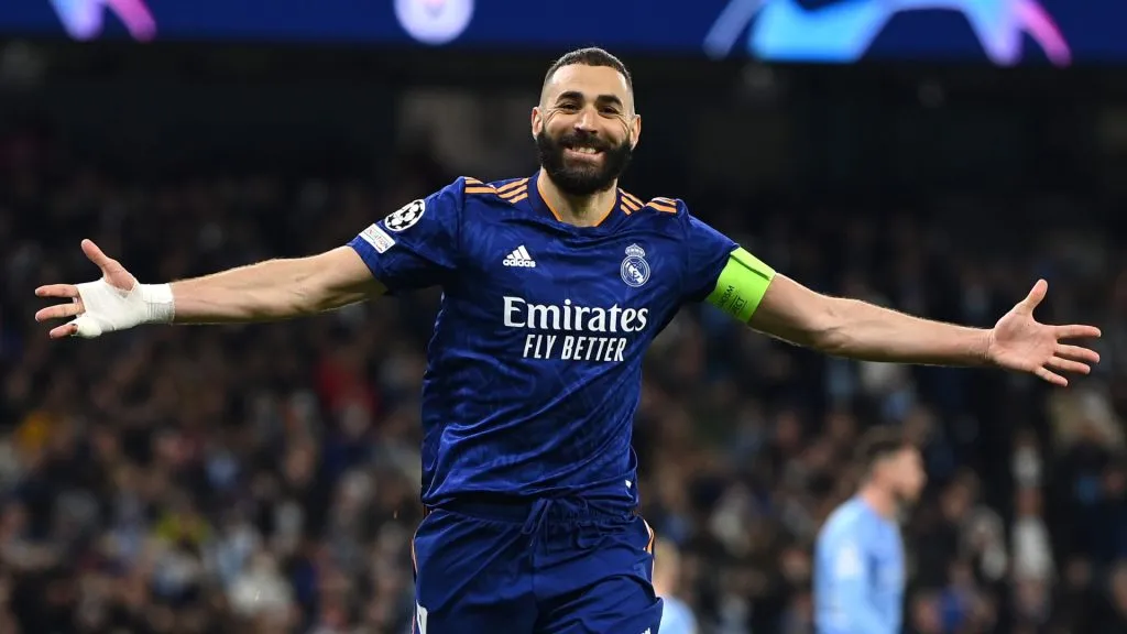 Karim Benzema of Real Madrid celebrates after scoring their side’s third goal from the penalty spot during the UEFA Champions League Semi Final Leg One match in 2022. (Source: David Ramos/Getty Images)