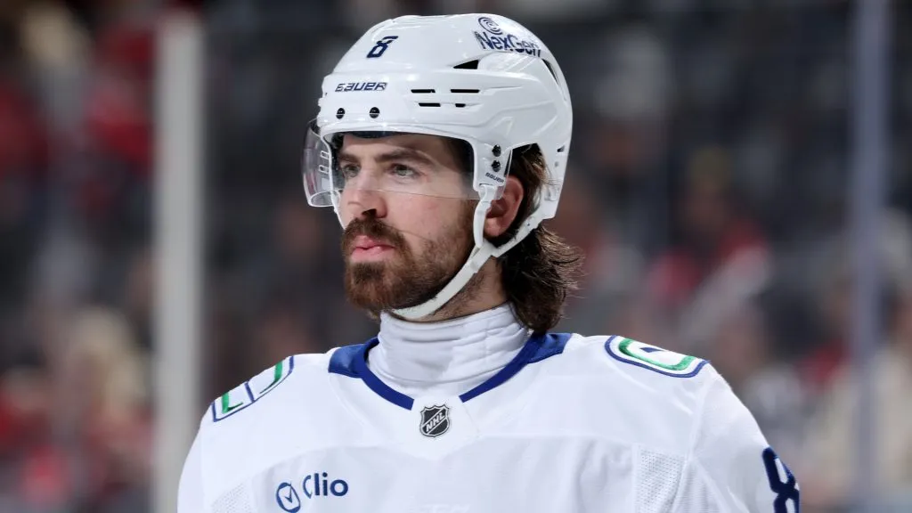 Conor Garland #8 of the Vancouver Canucks looks on before a face off in the third period against the New Jersey Devils at Prudential Center on March 24, 2025 in Newark, New Jersey. The Vancouver Canucks defeated the New Jersey Devils 4-3 after an overtime period and a shootout.