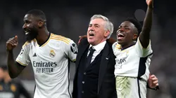 Antonio Ruediger, Carlo Ancelotti and Vinicius Junior of Real Madrid celebrate after the team's victory during the UEFA Champions League semi-final second leg match in 2024.