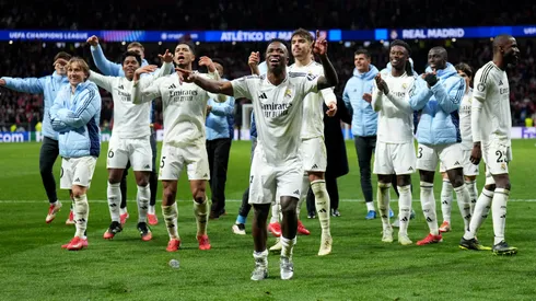 Vinicius Junior of Real Madrid celebrates victory with teammates after Real Madrid defeat Atletico de Madrid in the penalty shootout during the UEFA Champions League 2024/25 Round of 16 second leg match.