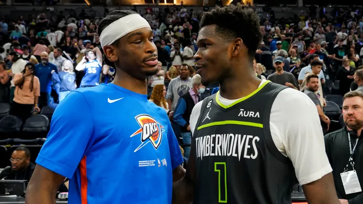 Shai Gilgeous-Alexander #2 of the Oklahoma City Thunder and Anthony Edwards #1 of the Minnesota Timberwolves