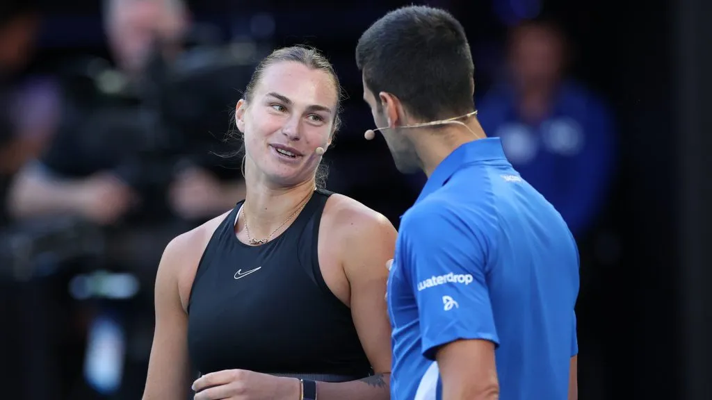 Aryna Sabalenka and Novak Djokovic react during a charity match ahead of the 2024 Australian Open. (Kelly Defina/Getty Images)