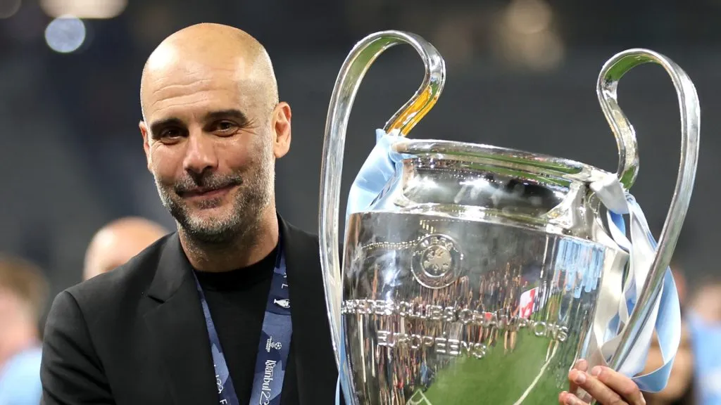 Pep Guardiola, Manager of Manchester City, celebrates with the UEFA Champions League trophy after the team's victory during the UEFA Champions League 2022/23 final match between FC Internazionale and Manchester City FC at Ataturk Olympic Stadium on June 10, 2023 in Istanbul, Turkey.