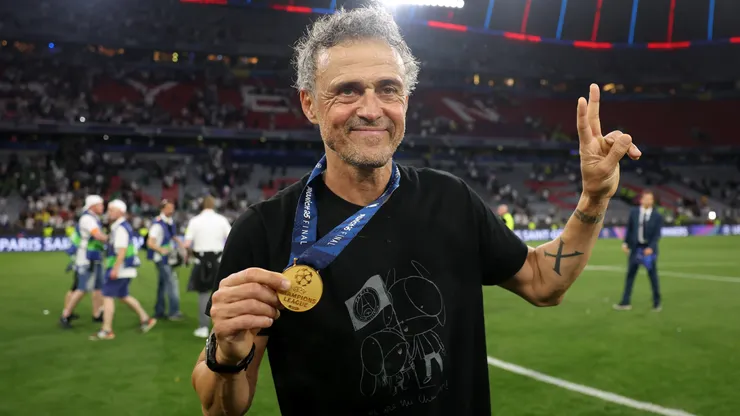 Luis Enrique, Head Coach of Paris Saint-Germain, poses for a photo with his winners medal, after their team's victory in the UEFA Champions League final.