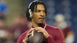 Jayden Daniels #5 of the Washington Commanders warms up prior to playing the Detroit Lions in the NFC Divisional Playoff at Ford Field on January 18, 2025 in Detroit, Michigan.