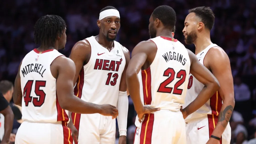 Miami Heat players discussing a play