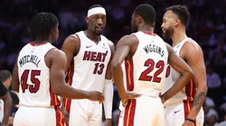 Bam Adebayo #13 of the Miami Heat huddles with teammates.