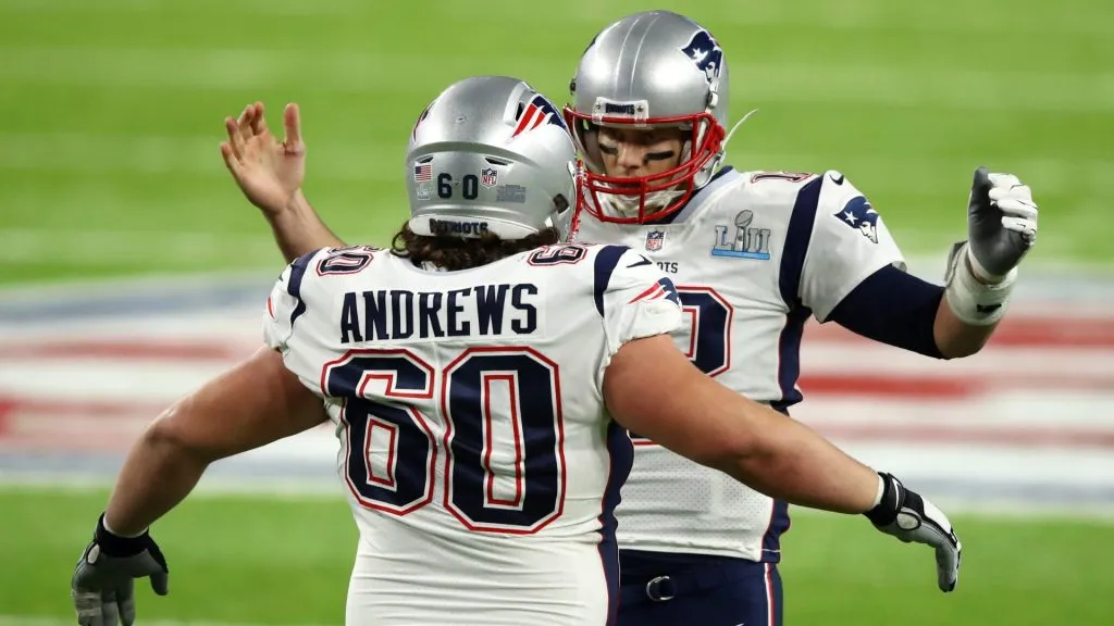 Tom Brady #12 celebrates with David Andrews #60 of the New England Patriots during the second quarter against the Philadelphia Eagles