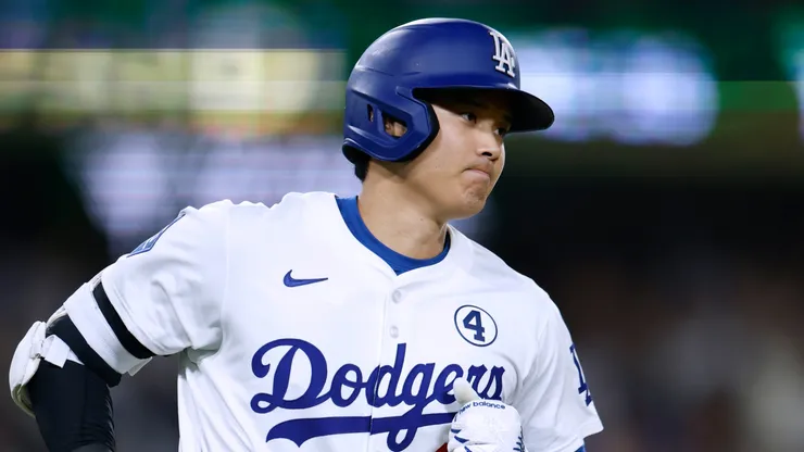 Shohei Ohtani #17 of the Los Angeles Dodgers runs to first after his solo home run, to trail 2-1 to the New York Mets, during the seventh inning at Dodger Stadium on June 02, 2025 in Los Angeles, California.