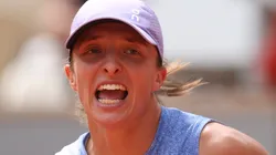 Iga Swiatek celebrates reaching the 2025 French Open semifinal