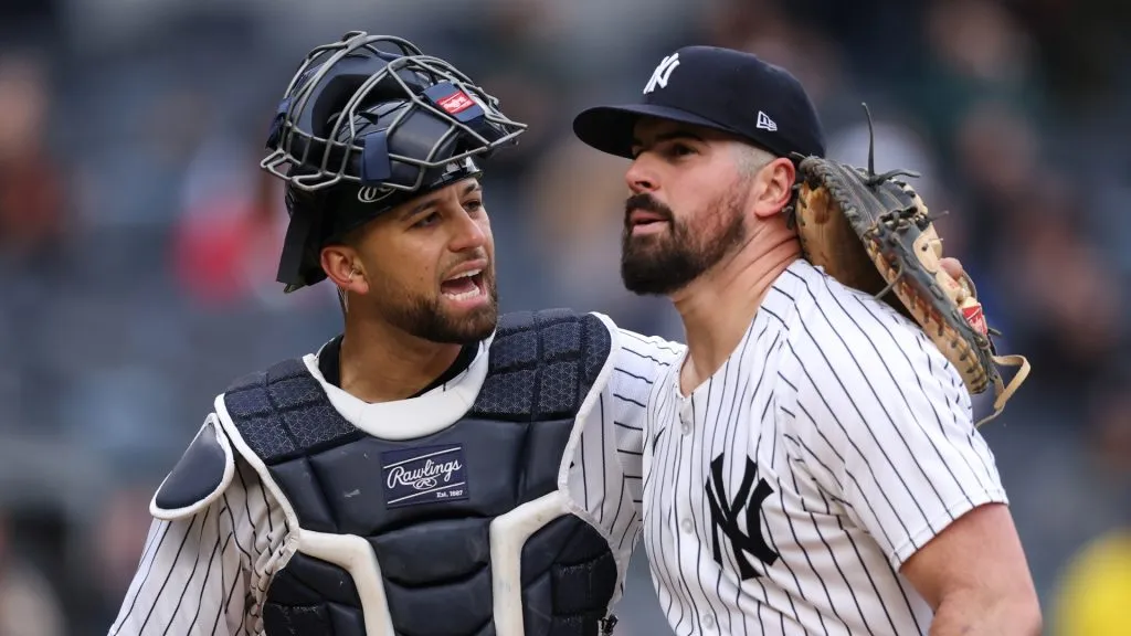 J.C. Escarra #25 and Carlos Rodon #55 of the New York Yankees walk off the field during the sixth inning of the game against the Texas Rangers at Yankee Stadium on May 22, 2025 in New York City. (Photo by Dustin Satloff/Getty Images)