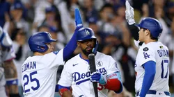 Shohei Ohtani #17 of the Los Angeles Dodgers celebrates his sacrifice fly to score Tommy Edman #25 behind Teoscar Hernández #37 and Francisco Alvarez #4 of the New York Mets.