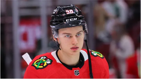 Connor Bedard #98 of the Chicago Blackhawks looks on against the Minnesota Wild during the second period of a preseason game at the United Center on October 05, 2023 in Chicago, Illinois.