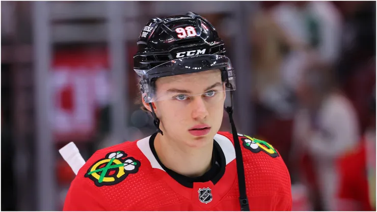 Connor Bedard #98 of the Chicago Blackhawks looks on against the Minnesota Wild during the second period of a preseason game at the United Center on October 05, 2023 in Chicago, Illinois.