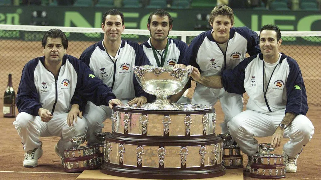 Spain team with the Davis Cup trophy after the fourth rubber between Juan Carlos Ferrero of Spain and Lleyton Hewitt of Australia in the final of the Davis Cup. (Gary M/ Getty Images)
