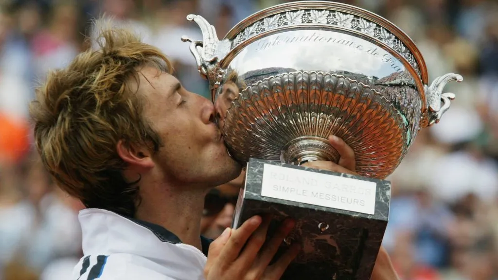 Juan Carlos Ferrero of Spain celebrates with Roland Garros trophy after winning his mens final match against Martin Verkerk. (Clive Mason/Getty Images)