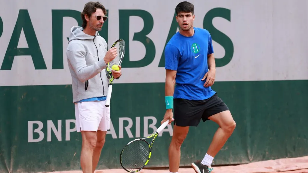 Carlos Alcaraz of Spain looks on during a practice session alongside his coach Juan Carlos Ferrero. (Clive Brunskill/Getty Images)