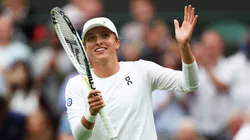 Iga Swiatek of Poland celebrates winning match point against Lin Zhu of People's Republic of China in the Women's Singles first round match during day one of The Championships Wimbledon 2023.