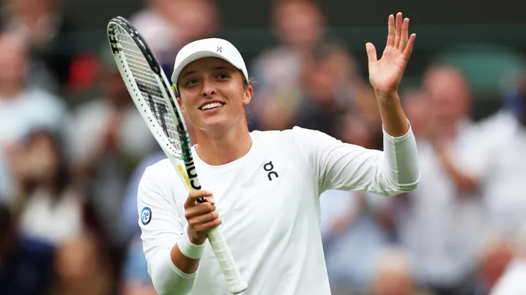 Iga Swiatek of Poland celebrates winning match point against Lin Zhu of People's Republic of China in the Women's Singles first round match during day one of The Championships Wimbledon 2023.