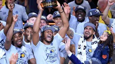 Myles Turner #33 of the Indiana Pacers celebrates with the Bob Cousy Trophy after the 125-108 win against the New York Knicks in Game Six of the Eastern Conference Finals of the 2025 NBA Playoffs at Gainbridge Fieldhouse on May 31, 2025 in Indianapolis, Indiana.