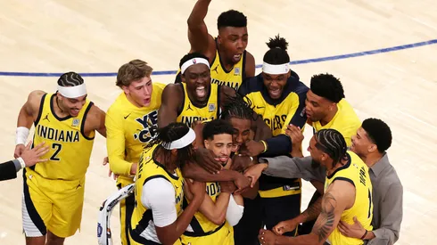 Tyrese Haliburton of the Indiana Pacers is congratulated by his teammates after scoring a game-tying basket in Game One of the Eastern Conference Finals of the 2025 NBA Playoffs.
