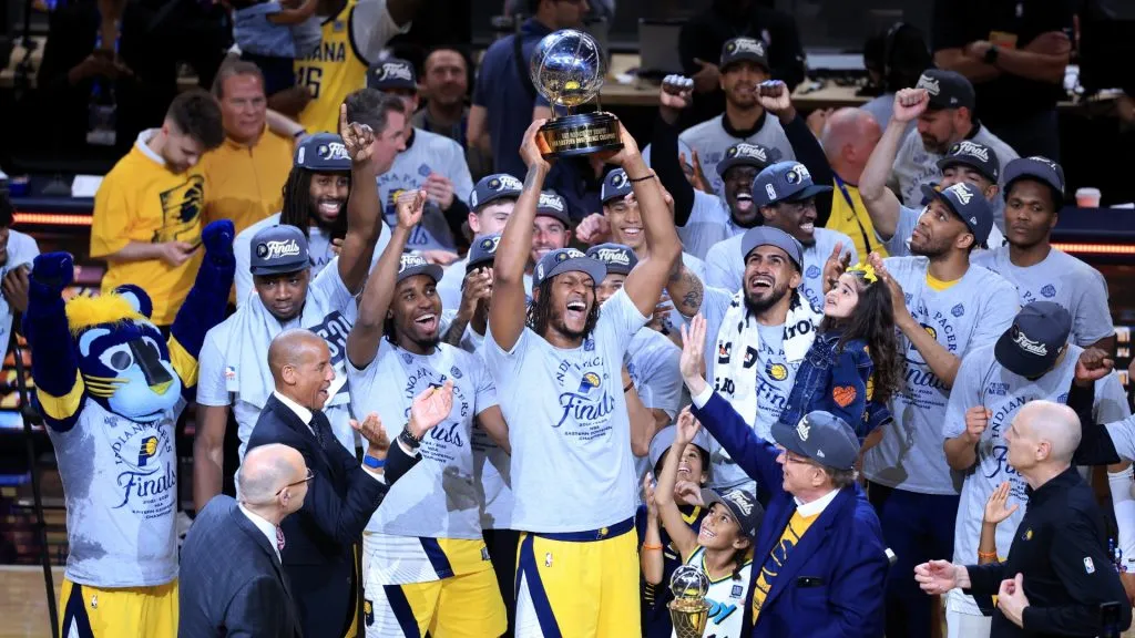 Myles Turner celebrates with the Bob Cousy Trophy after the 125-108 win against the New York Knicks in Game Six of the Eastern Conference Finals of the 2025 NBA Playoffs. (Source: Justin Casterline/Getty Images)