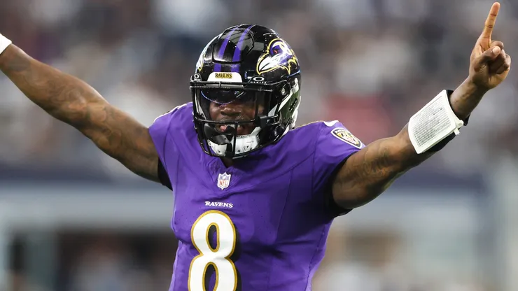Quarterback Lamar Jackson #8 of the Baltimore Ravens celebrates throwing a touchdown pass against the Dallas Cowboys during the second quarter at AT&T Stadium on September 22, 2024 in Arlington, Texas.