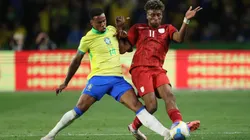 Gabriel of Brazil and Kevin Rodriguez of Ecuador battle for the ball during a South American FIFA World Cup 2026 Qualifier match.