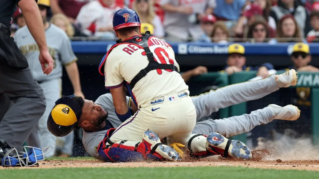 Jackson Chourio #11 of the Milwaukee Brewers is tagged out at home plate by J.T. Realmuto #10 of the Philadelphia Phillies in the second inning during a game at Citizens Bank Park on May 31, 2025 in Philadelphia, Pennsylvania. (Photo by Hunter Martin/Getty Images)