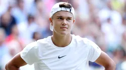 Holger Rune of Denmark reacts against Carlos Alcaraz of Spain in the Men's Singles Quarter Final match during day ten of The Championships Wimbledon 2023.