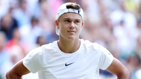 Holger Rune of Denmark reacts against Carlos Alcaraz of Spain in the Men's Singles Quarter Final match during day ten of The Championships Wimbledon 2023.