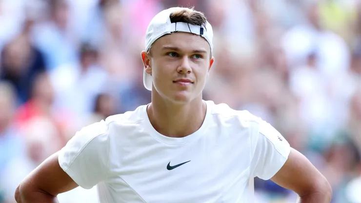Holger Rune of Denmark reacts against Carlos Alcaraz of Spain in the Men's Singles Quarter Final match during day ten of The Championships Wimbledon 2023.