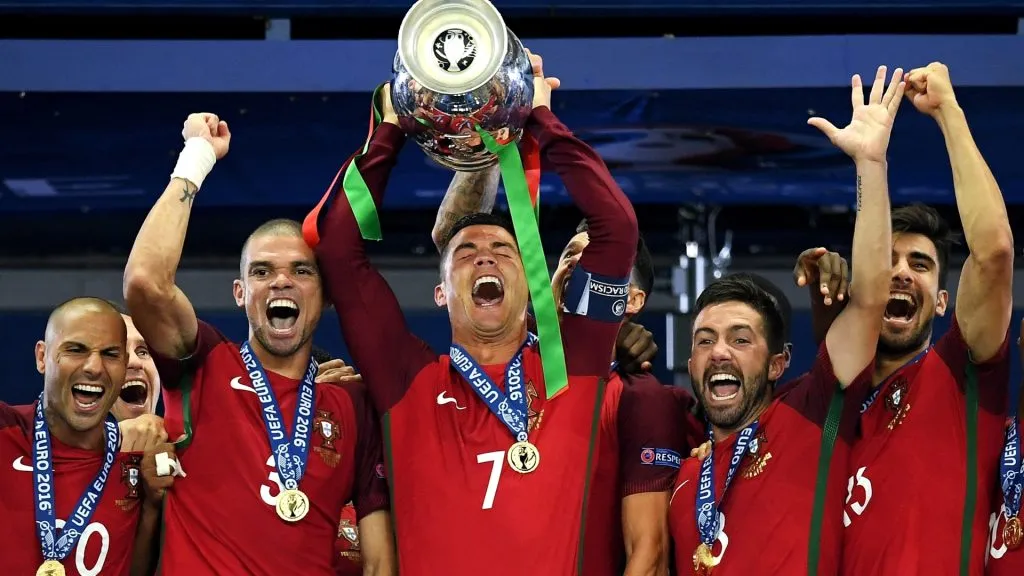 Cristiano Ronaldo of Portugal lifts the Henri Delaunay trophy after his side win 1-0 against France during the UEFA EURO 2016 Final match between Portugal and France. (Source: Matthias Hangst/Getty Images)