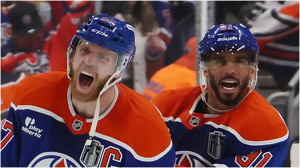 Connor McDavid #97 and Evander Kane #91 of the Edmonton Oilers celebrate their overtime win over the Florida Panthers in Game One of the 2025 Stanley Cup Final at Rogers Place on June 04, 2025 in Edmonton, Alberta, Canada.