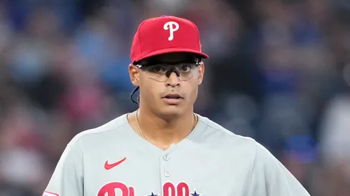 Jesus Luzardo #44 of the Philadelphia Phillies awaits being taken out of the game against the Toronto Blue Jays with teammates Rafael Marchan #13 and Bryson Stott #5 against the Toronto Blue Jays during the third inning in their MLB game at the Rogers Centre on June 5, 2025 in Toronto, Ontario, Canada.